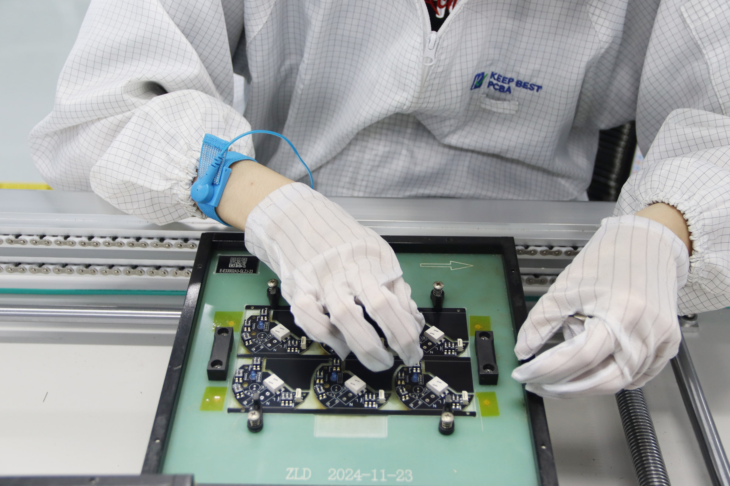 KeepBest operator inspecting an assembled board